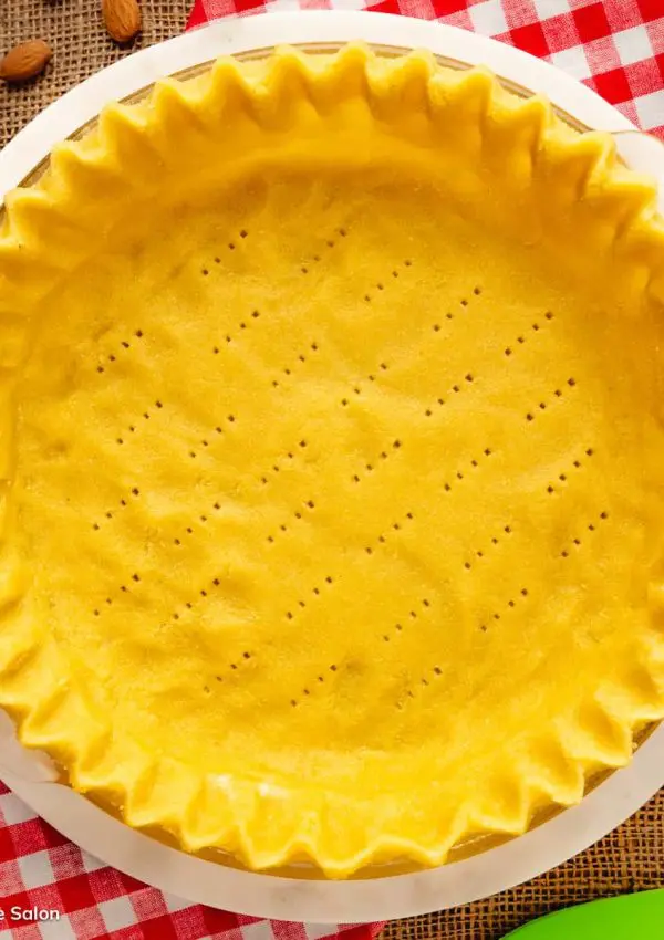A monk fruit sweetened almond flour pie crust in a pie pan.