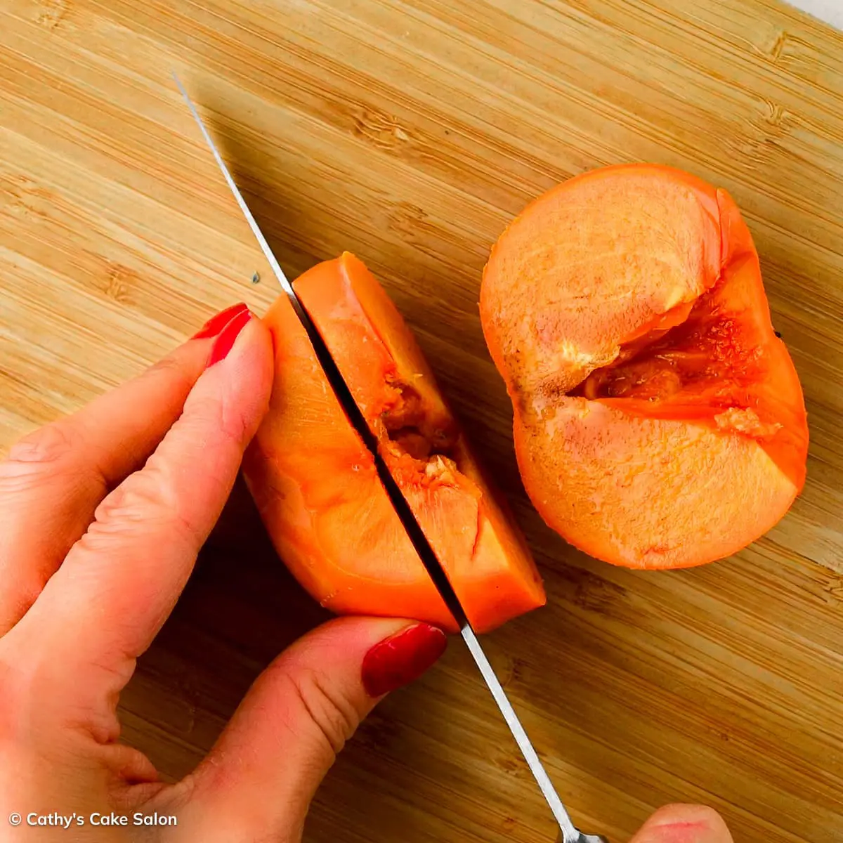 Step two in this jam recipe: Slice the persimmon.