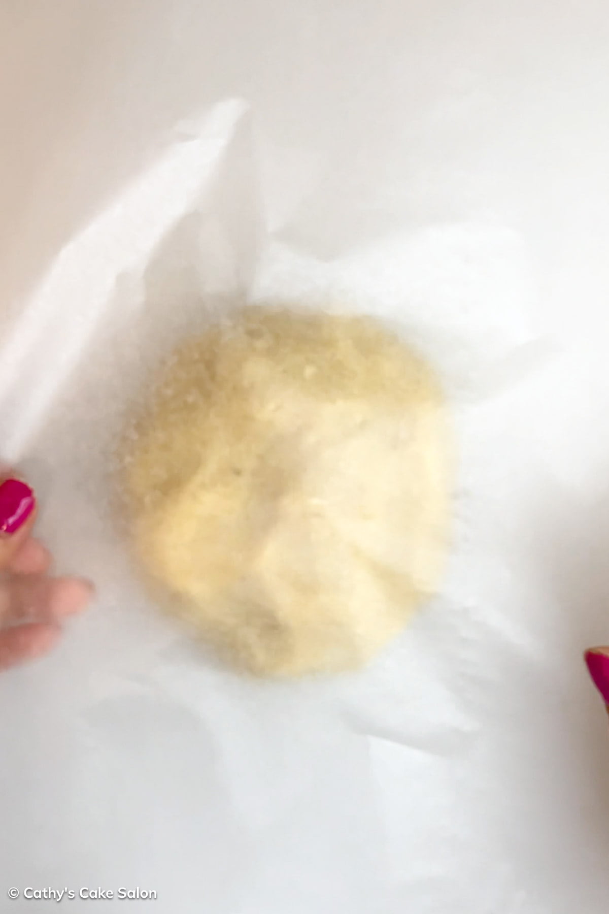 Step 2 to make this recipe: Cover dough ball with parchment paper.