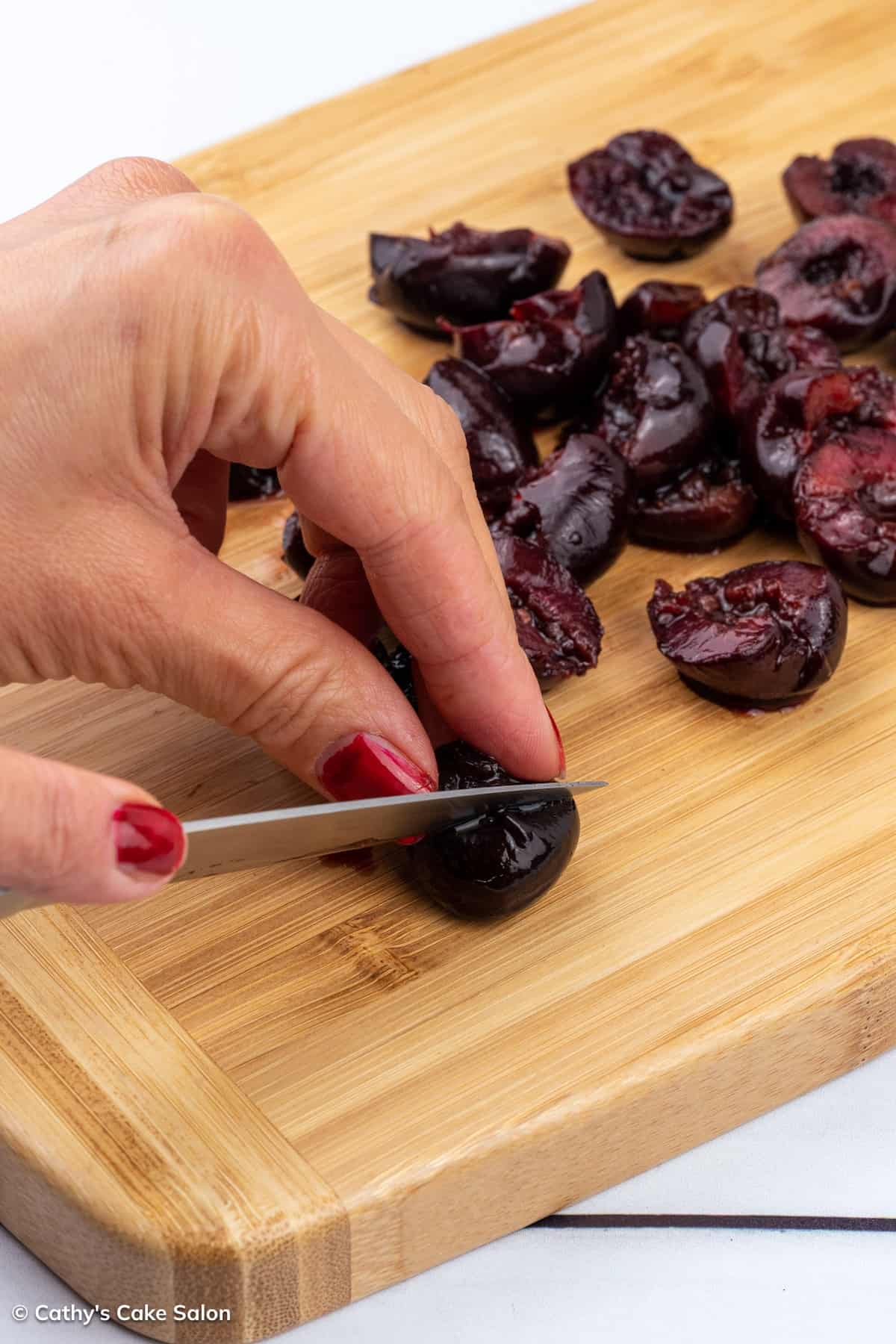 A step in the recipe: Cutting the sour cherries.