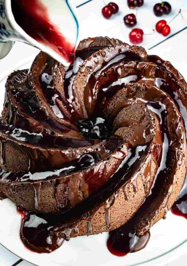 Healthy, sugar free black forest bundt cake made with almond flour, cherry brandy and fresh cherries.