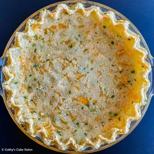 Step 6 in this recipe: The baked cheddar and chive pie crust.