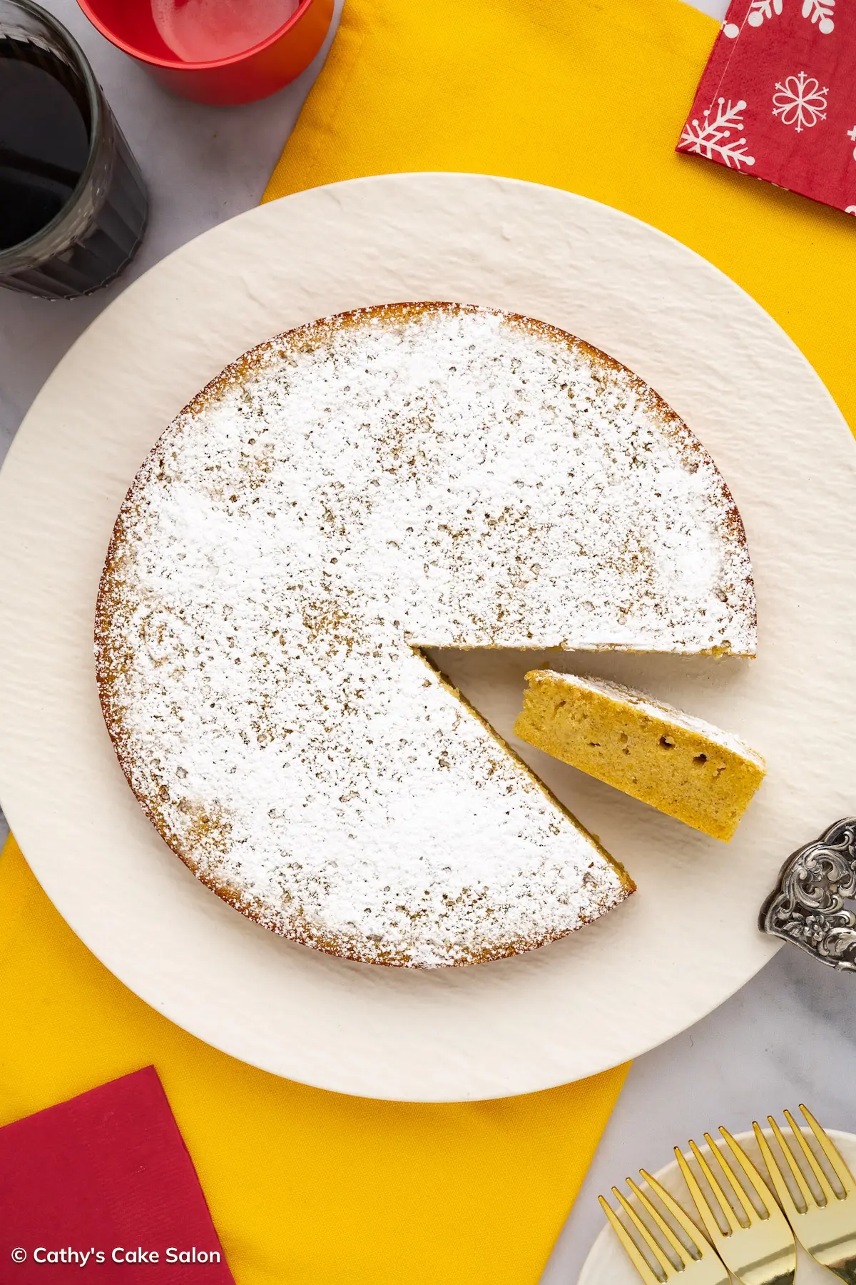 Festive Guyanese Sponge Cake topped with powdered sugar for Christmas.
