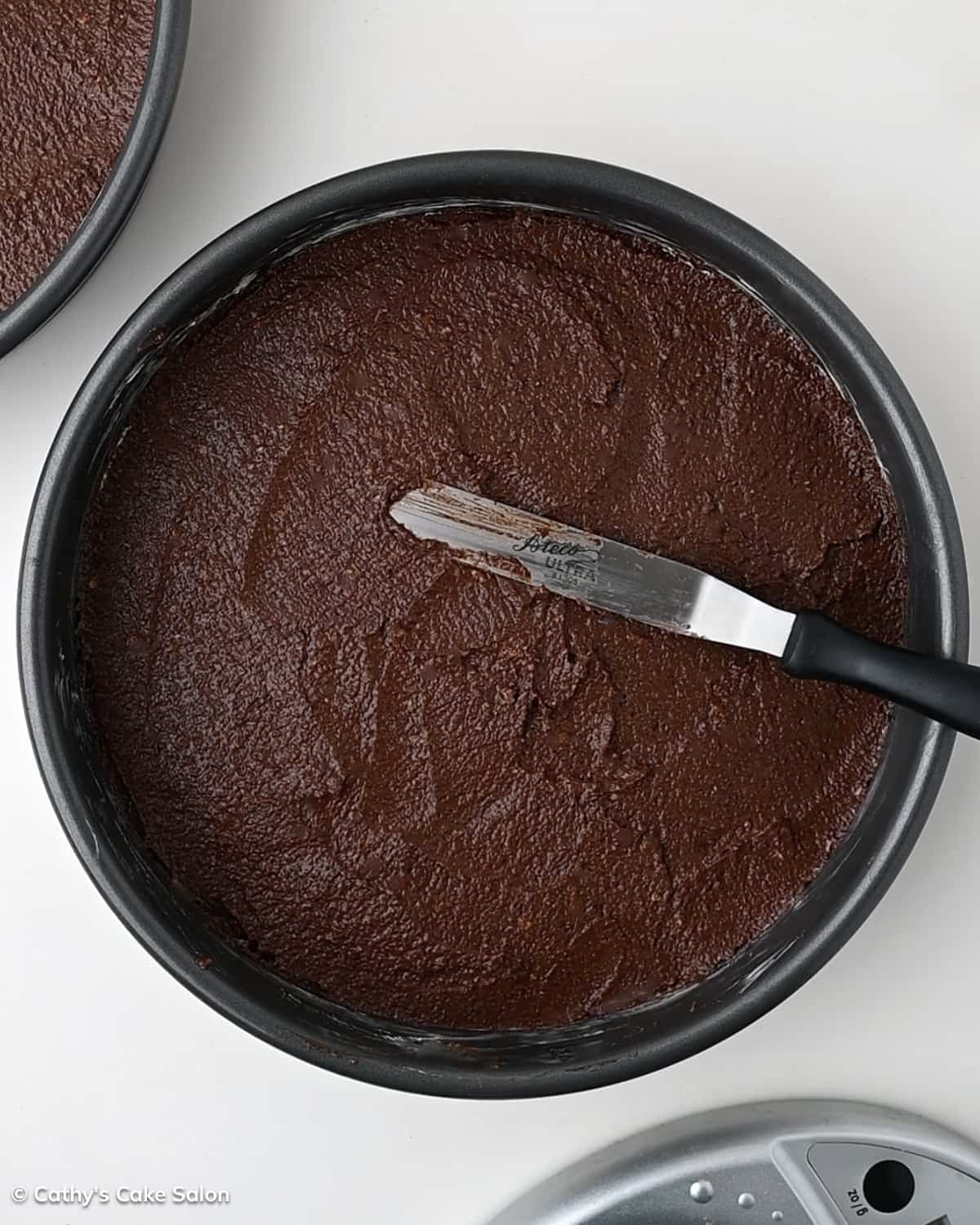 A step in the recipe: The cakes are in the pans and ready for baking.