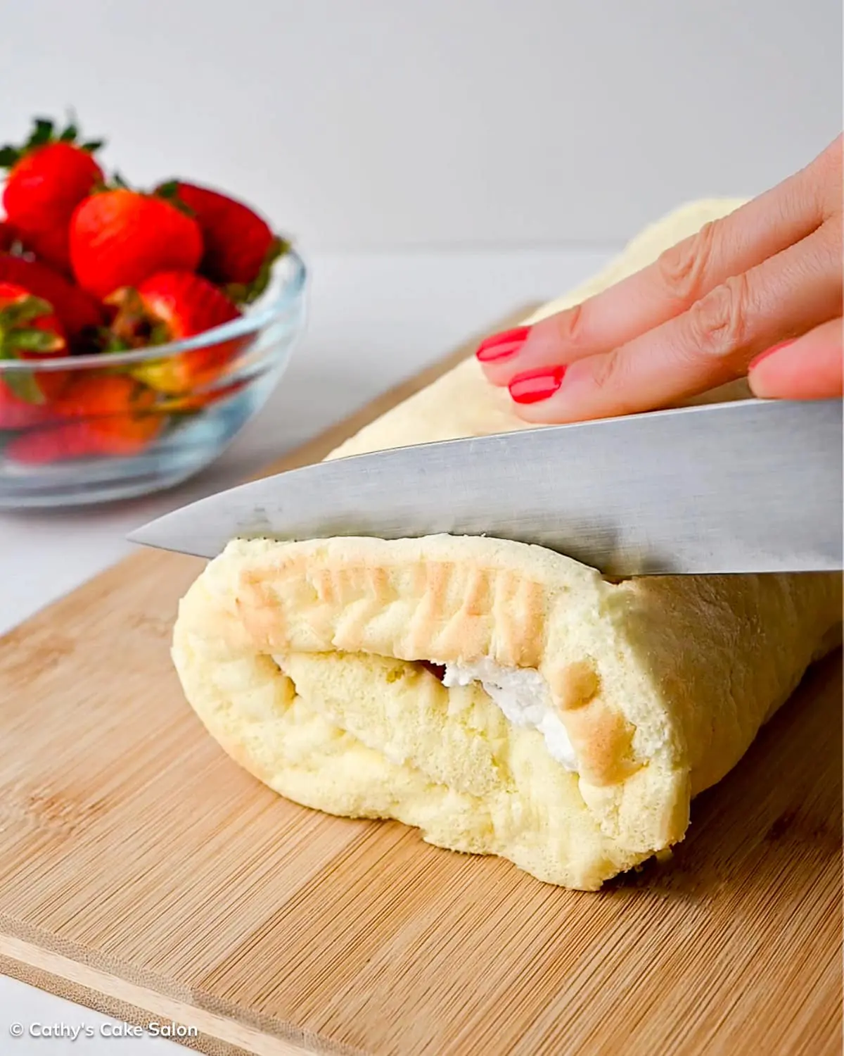 Slicing the ends off of this Japanese roll cake.