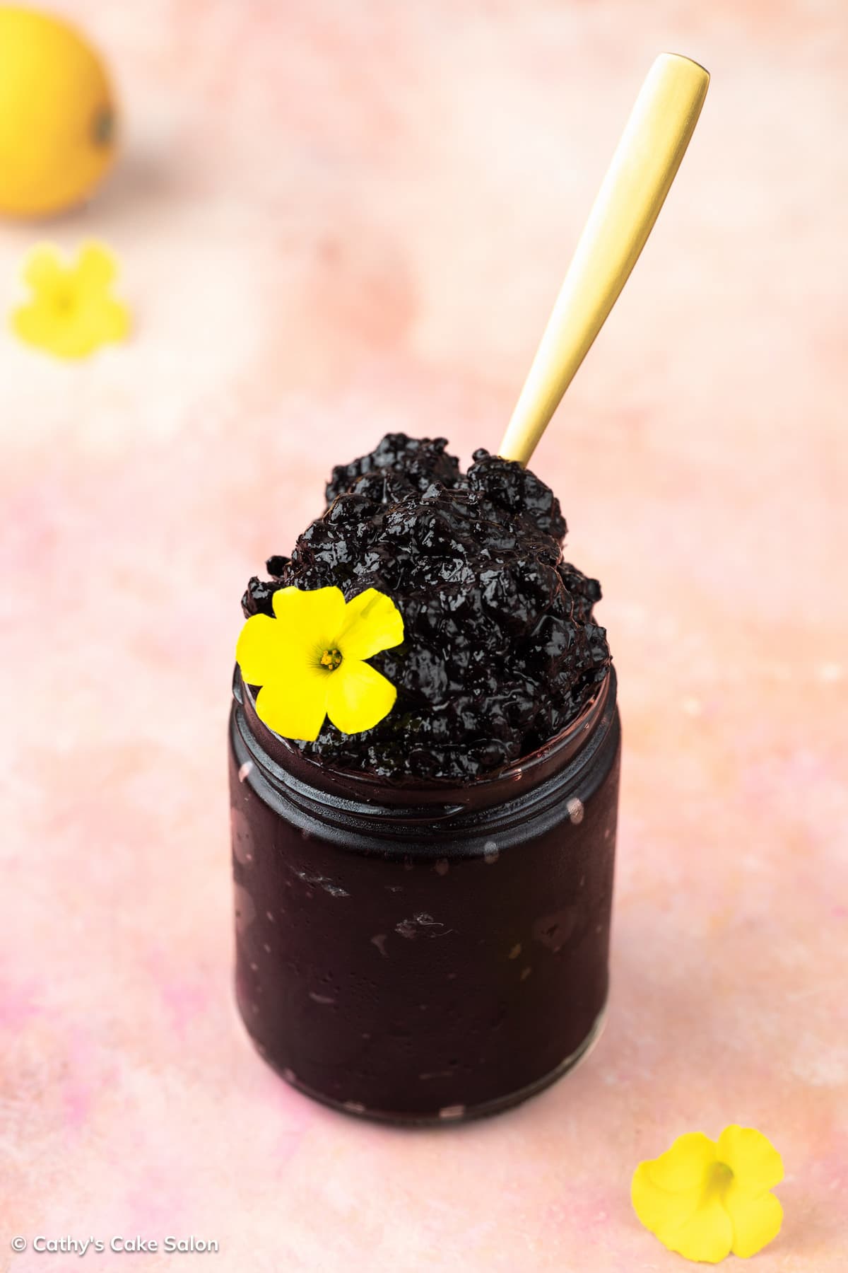 A jar of homemade sugar free blueberry jam sweetened with monk fruit sweetener.