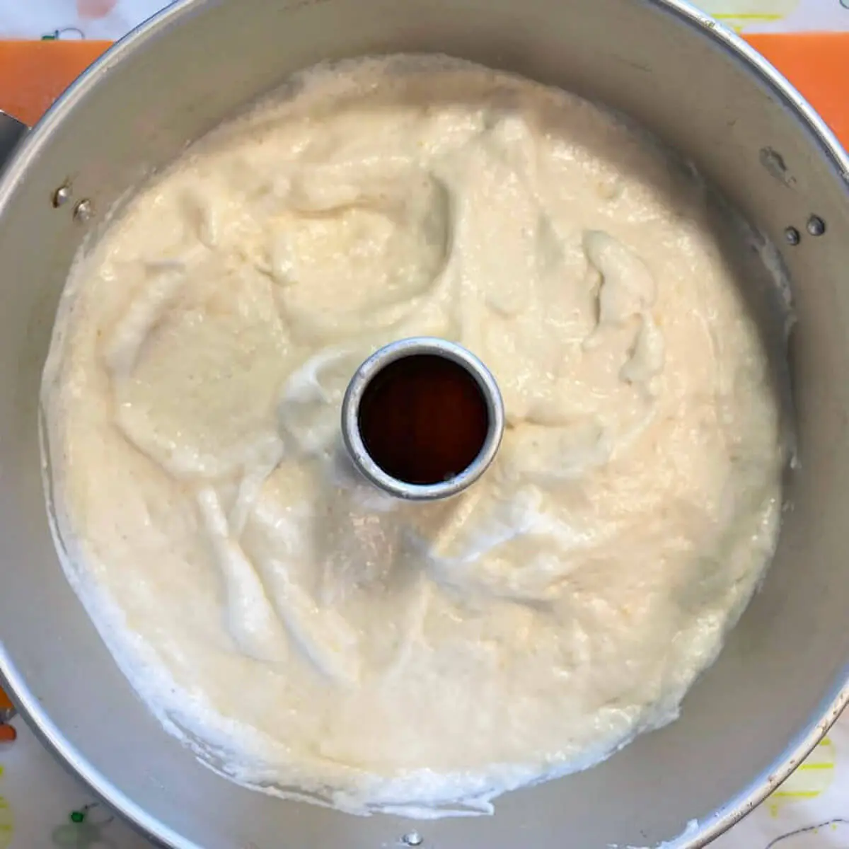A step in the recipe: Add the meringue mixture to an angel food cake pan.