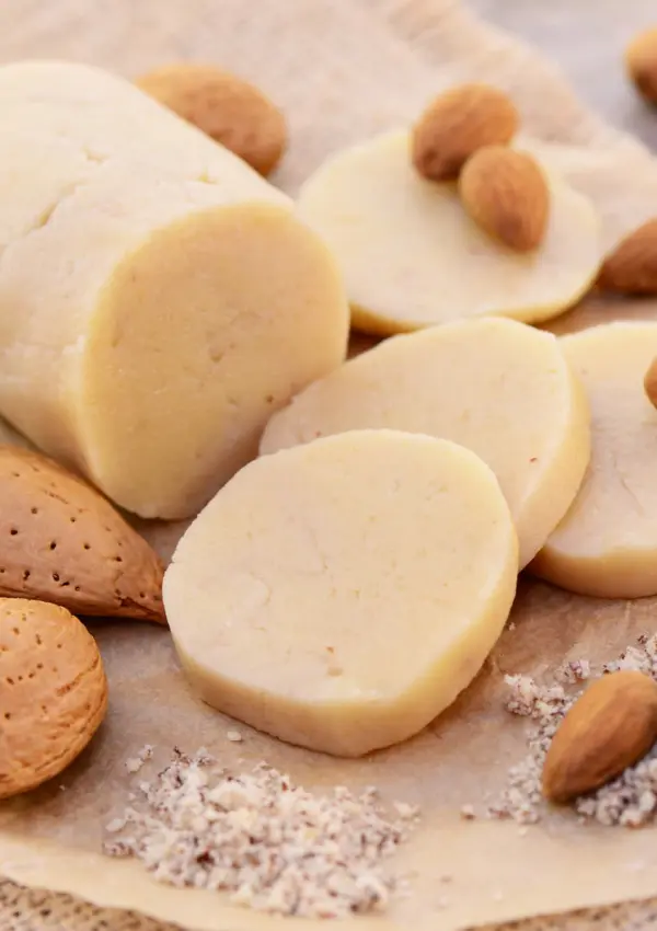 Sugar free Keto Marzipan sprinkled with whole almonds.