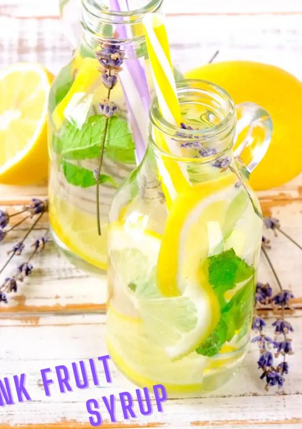 2 glasses of water sweetened with monk fruit syrup and filled with fresh lemon slices and lavender branches.